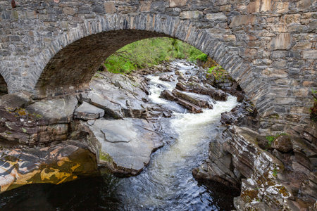Old stone bridge spanning the River Tay in Scotlandの写真素材