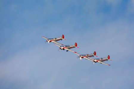 Four Yakovlev Yak-52/50 planes in tight formation