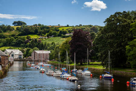 TOTNES, DEVON, UK - JULY 29 : Boats moored on the River Dart near Totnes on July 29, 2012. Unidentified peopleのeditorial素材