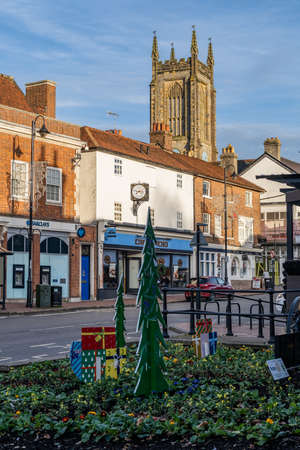 EAST GRINSTEAD,  WEST SUSSEX, UK - DECEMBER 9: View of the High Street in East Grinstead, West Sussex on December 9, 2021. Three unidentified peopleのeditorial素材