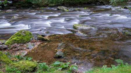 View of fast flowing water in the East Lyn Riverの写真素材