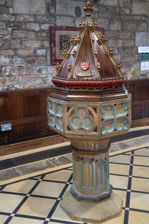 EAST GRINSTEAD, WEST SUSSEX, UK - MARCH 28: Decorative font in St Swithuns Church , East Grinstead,  West Sussex on March 28, 2022のeditorial素材