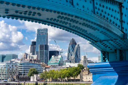 LONDON, UK - AUGUST 22. View of modern architecture in the City from underneath Tower Bridge in London on August 22, 2014. Unidentified peopleのeditorial素材
