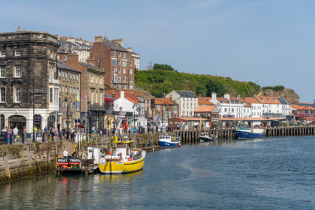 WHITBY,  NORTH YORKSHIRE, UK - JULY 19: View of the sea front in Whitby, North Yorkshire on July 19, 2022. Unidentified peopleのeditorial素材