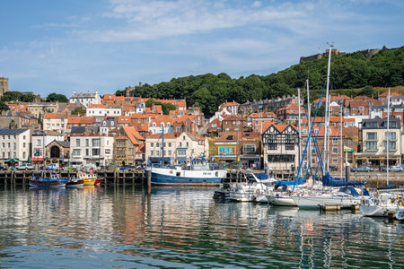 SCARBOROUGH,  NORTH YORKSHIRE, UK - JULY 18: View of the seafront in Scarborough, North Yorkshire on July 18, 2022. Unidentified peopleのeditorial素材