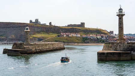 WHITBY,  NORTH YORKSHIRE, UK - JULY 19: View of the harbour entrance in Whitby, North Yorkshire on July 19, 2022のeditorial素材