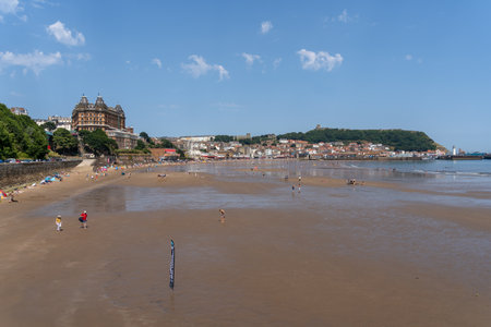 SCARBOROUGH,  NORTH YORKSHIRE, UK - JULY 18: View of the sea front in Scarborough, North Yorkshire on July 18, 2022. Unidentified peopleのeditorial素材
