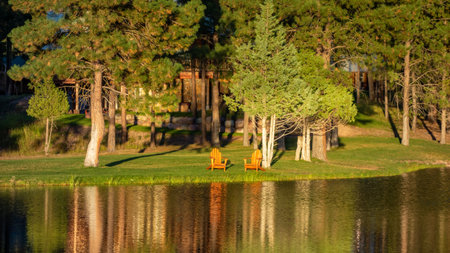 SEELEY LAKE, MONTANA, USA - SEPTEMBER 20 : Evening sunshine on a wooden chalet at Seeley Lake Missoula County in Montana on September 20, 2013のeditorial素材