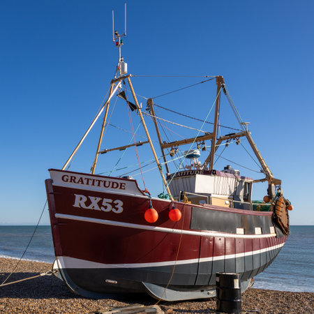 Hastings, East Sussex, UK - February 12. View of a fishing boat on the beach at Hastings, East...
