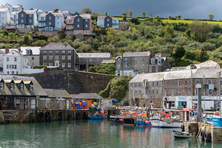 MEVAGISSEY, CORNWALL, UK, MAY 3. View of Mevagissey harbour in Cornwall on May 3, 2024. Three...