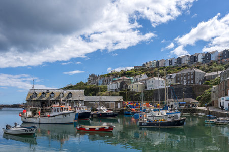 MEVAGISSEY, CORNWALL, UK, MAY 3. View of Mevagissey harbour in Cornwall on May 3, 2024. Unidentified...