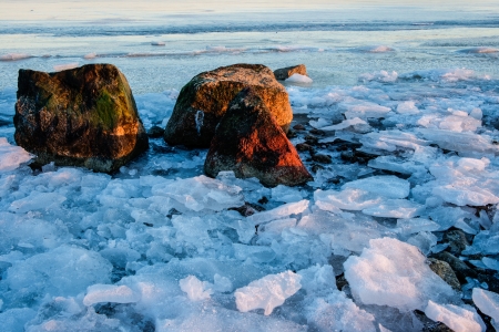 Frozen lake with stonesの写真素材