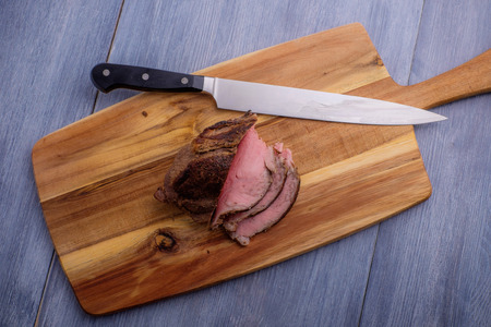 roast beef on cutting boardの写真素材
