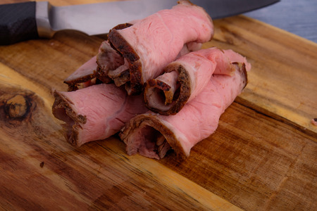 roast beef on cutting boardの写真素材