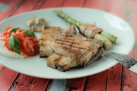Steak with aspargus and some vegetablesの写真素材
