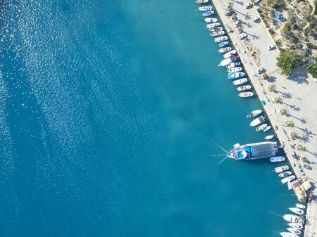 Top view of yachts moored in marina.
