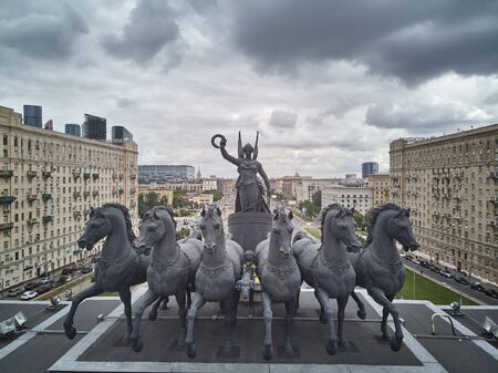 Moscow, Russia - June 2019. Nike Goddess with six horses sculpture on the top of Triumphal arch on Kutuzovskiy avenue. Aerial viewのeditorial素材