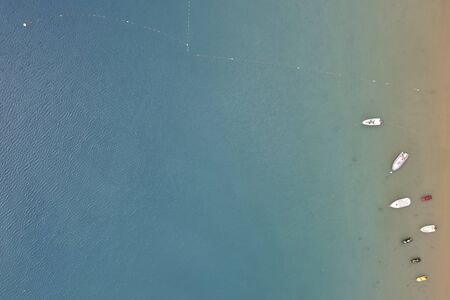 Boats in the sea harbor. Top down aerial view.
