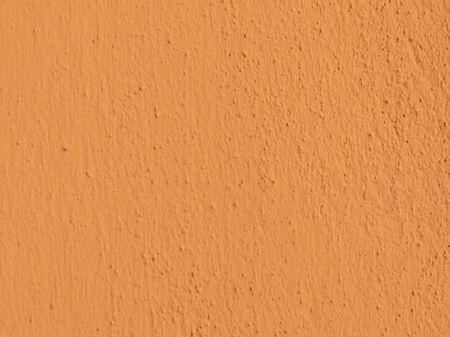 Textured plaster in terracotta . Background or texture seamless pattern.
