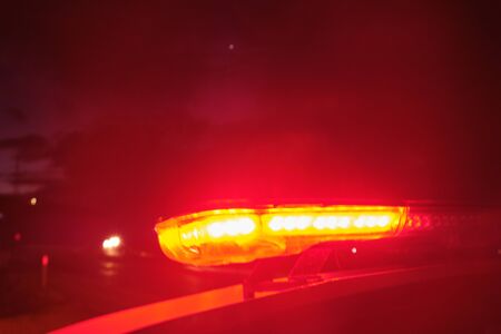 police car flashing lights in the night selective focus.の写真素材