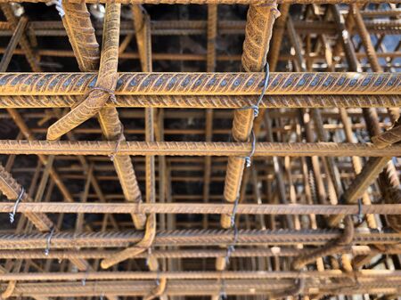 Metal reinforcement of concrete wall with metal clamps.の写真素材