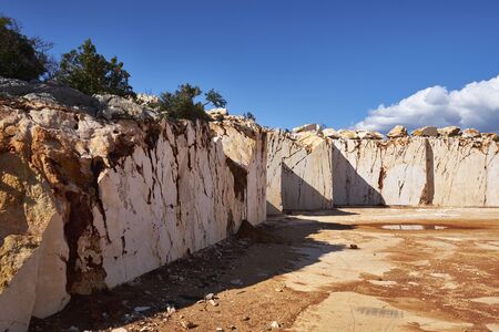 abandoned marble quarry in the sunny day.