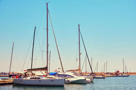 Yachts and boats moored at marina toned.の写真素材