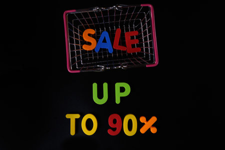 Black friday concept. Sale up to 90 per cent. Shopping basket at blackの写真素材