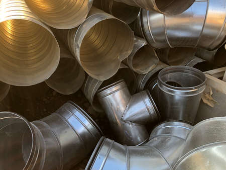 Halvanized ventilation pipe elbows. Industrial metal pipes.
