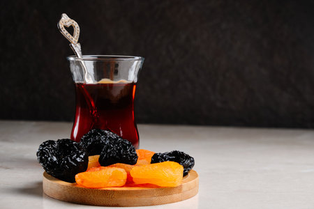 Turkish tea and dry fruits at tableの写真素材