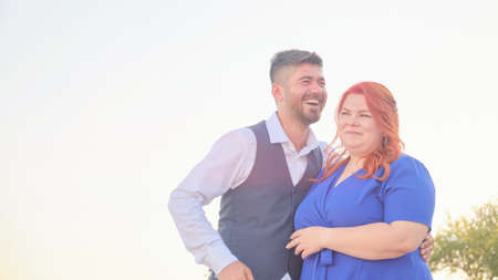 Man hugs his beloved woman smilingの写真素材