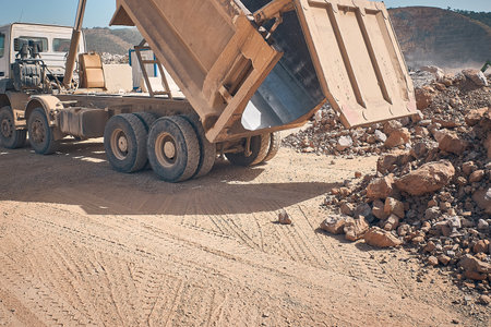 Dump truck unloads soil from truck back