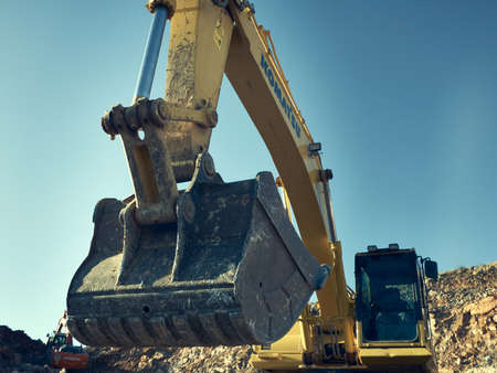 Komatsu excavator at road construction worksのeditorial素材