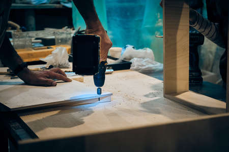 People works at carpentry workshop