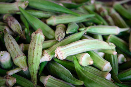Fresh green okra pods on a marketの写真素材
