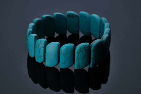 Turquoise bracelet at dark backgroundの写真素材