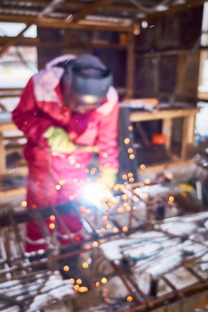 Welder at construction site