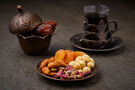 Dried fruits nut mix and arabic teaの写真素材