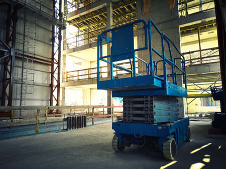Scissor lift platform inside of industrial building