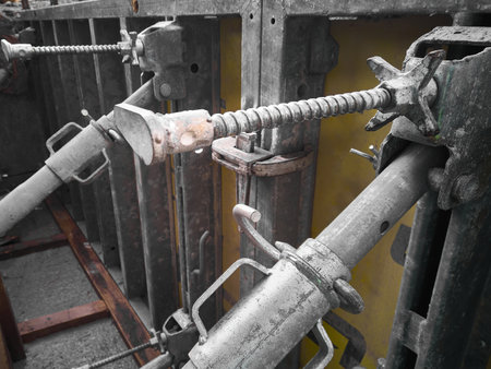 Metal props hold formwork at construction site