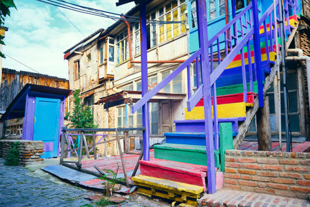 Multi-colored wooden stairway of old georgian houseの写真素材
