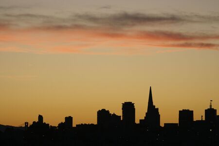 San Francisco skyline silhouetted in sunrise.の写真素材