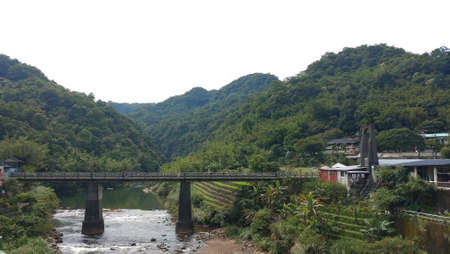 The view of the rail bridge across the river.