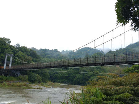 The suspension bridge across the river