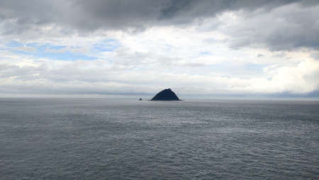 The view of the single island on the beautiful coastの写真素材