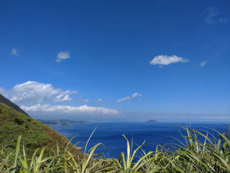 Overlooking the mountain and sea together on the coast in the northeastern Taiwanの写真素材