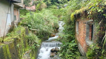The view of the small waterfall in the creek