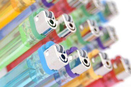colorful cigarette lighters arranged in a designの写真素材