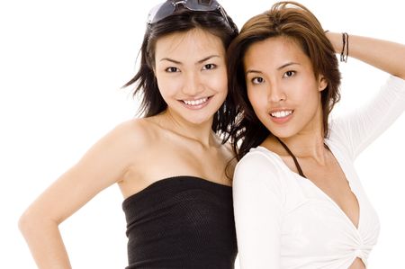 Two pretty asian women on white backgroundの写真素材