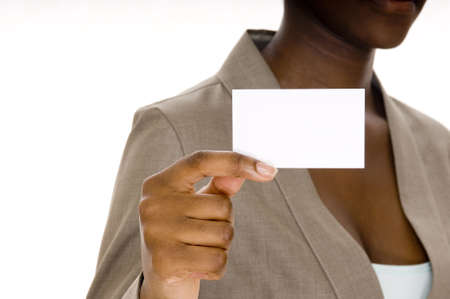 A young black woman holds up a blank business cardの写真素材